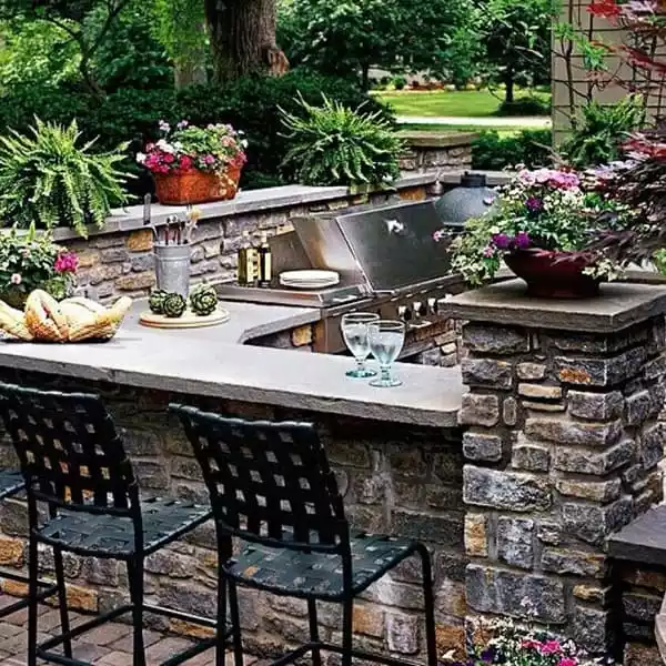 Stone wall outdoor kitchen